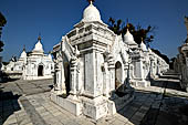 Myanmar - Mandalay, Kuthodaw Pagoda. 729 white pitaka pagodas contain the Tipitaka, the sacred texts of Theravada Buddhism. 